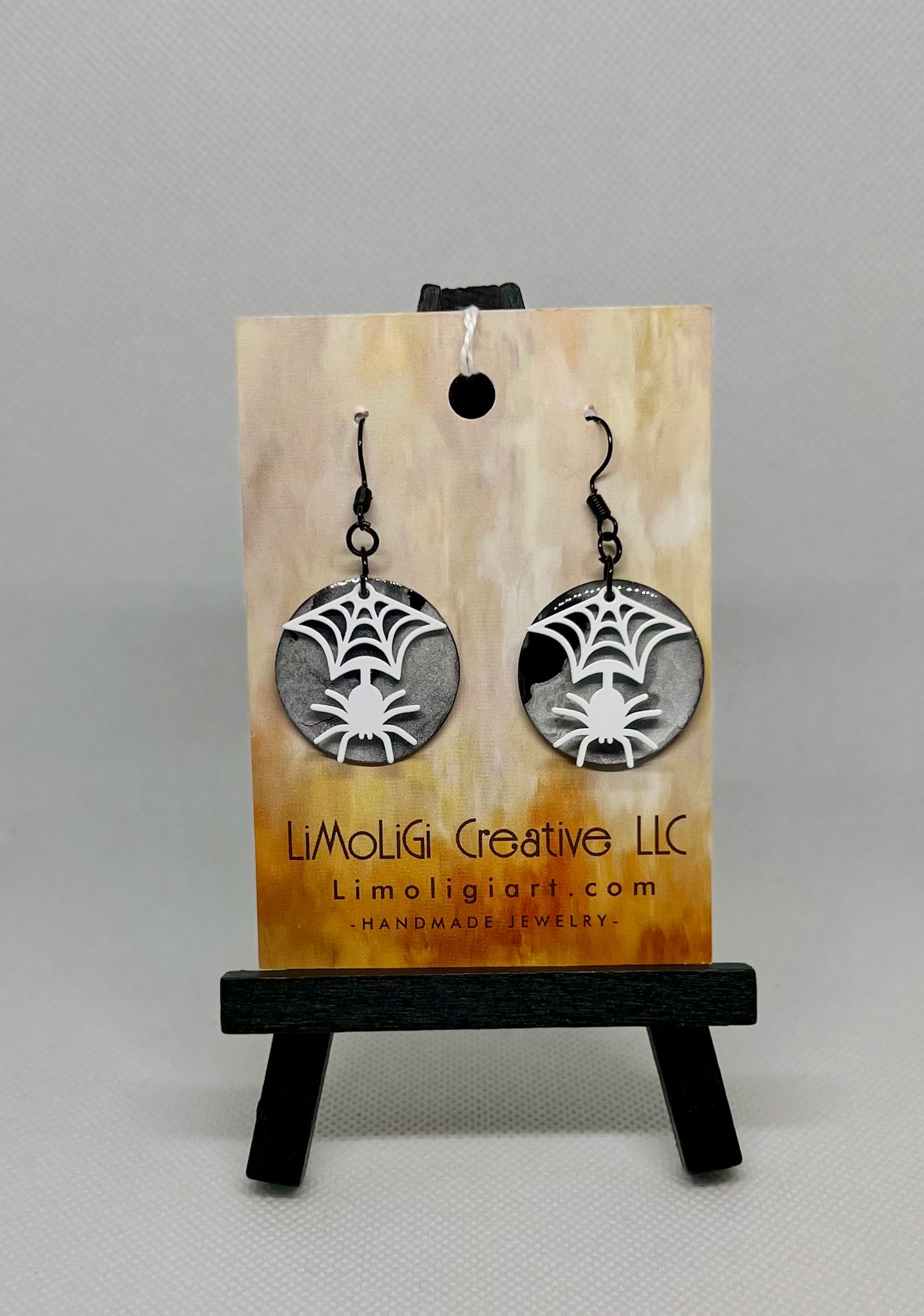 E24-127 White Spider on Circles #1