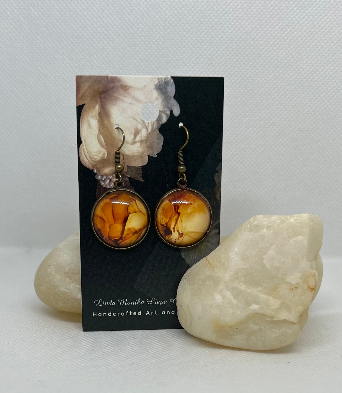 E25-043 Rockin' Cliffs Alcohol Ink Painting in brass setting with glass cabochon