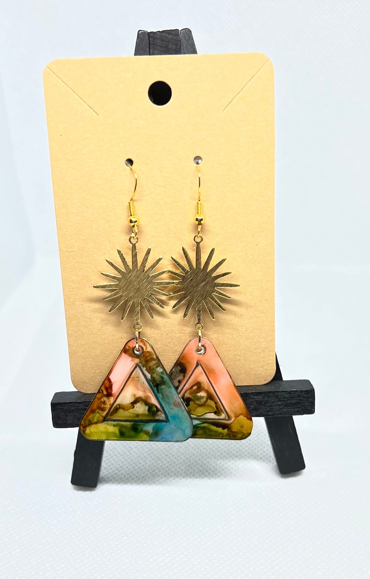 Muti-colored triangles hanging from a sun