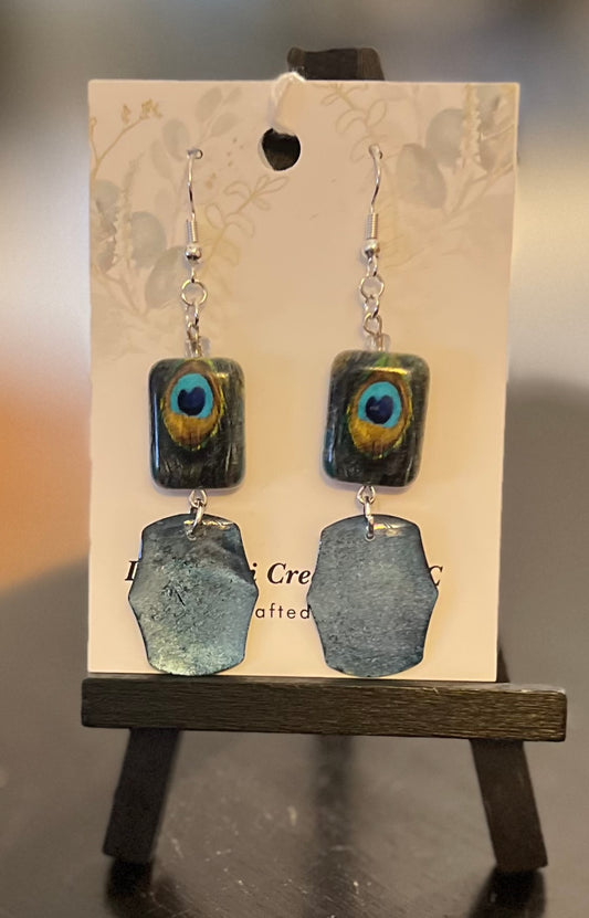 E26-025 “Peacock” bead with black and blue