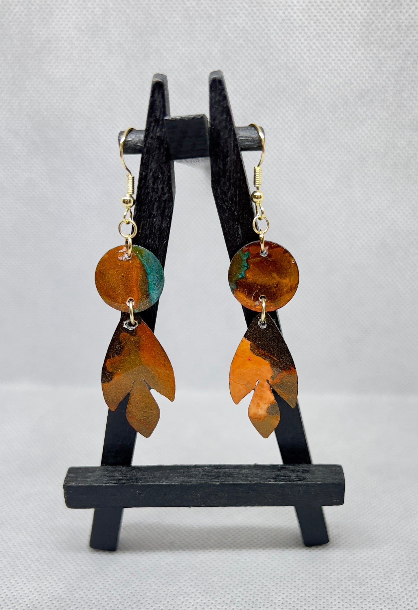 E25-011 Arrowhead with Circle in Charcoal Burnt Orange and Teal