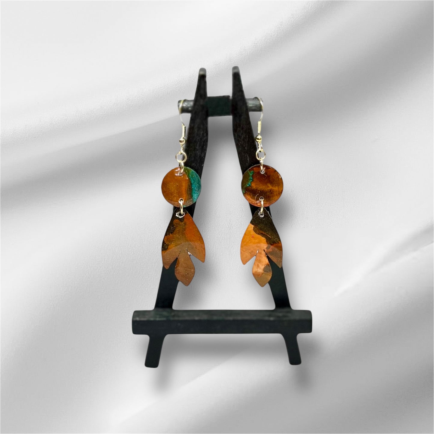 E25-011 Arrowhead with Circle in Charcoal Burnt Orange and Teal