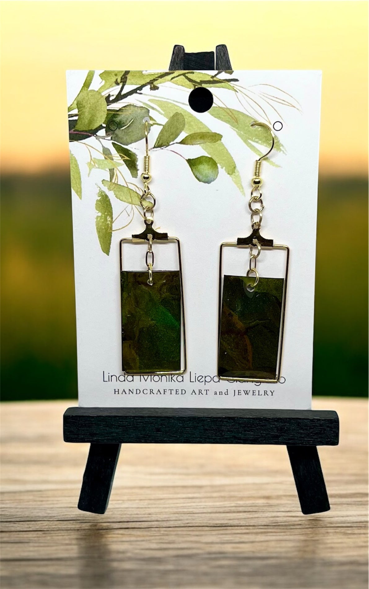 E25-062 Green Rectangle suspended in gold rectangle setting